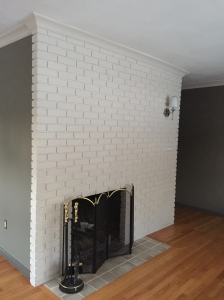 fireplace after removing mantle, changing light, and painting