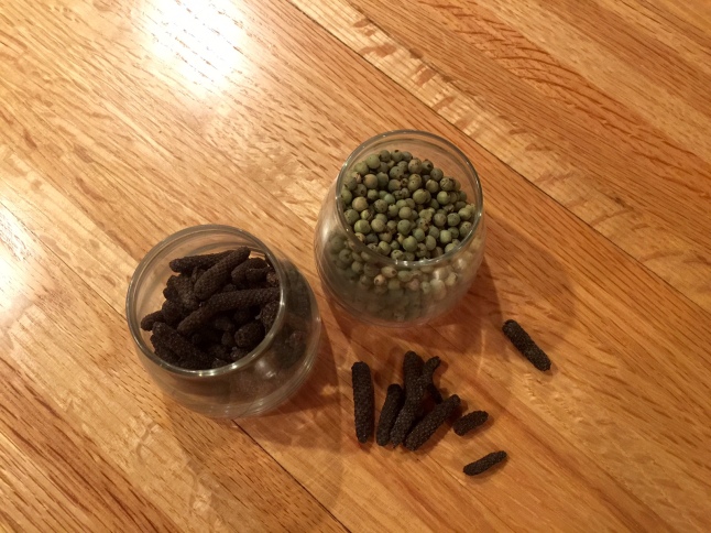 green and long black peppercorns